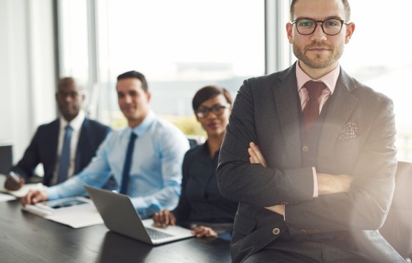 Professional sitting on desk
